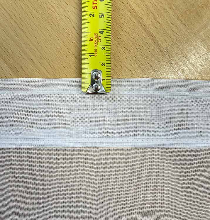 1cm between top row of stitching and top of curtain